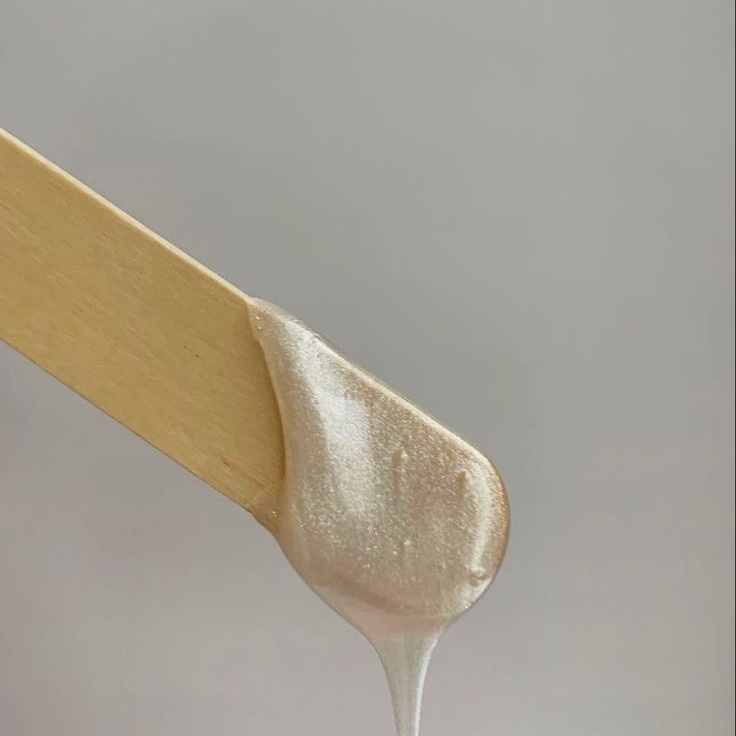 Soft neutral imagery representing the studio's waxing services